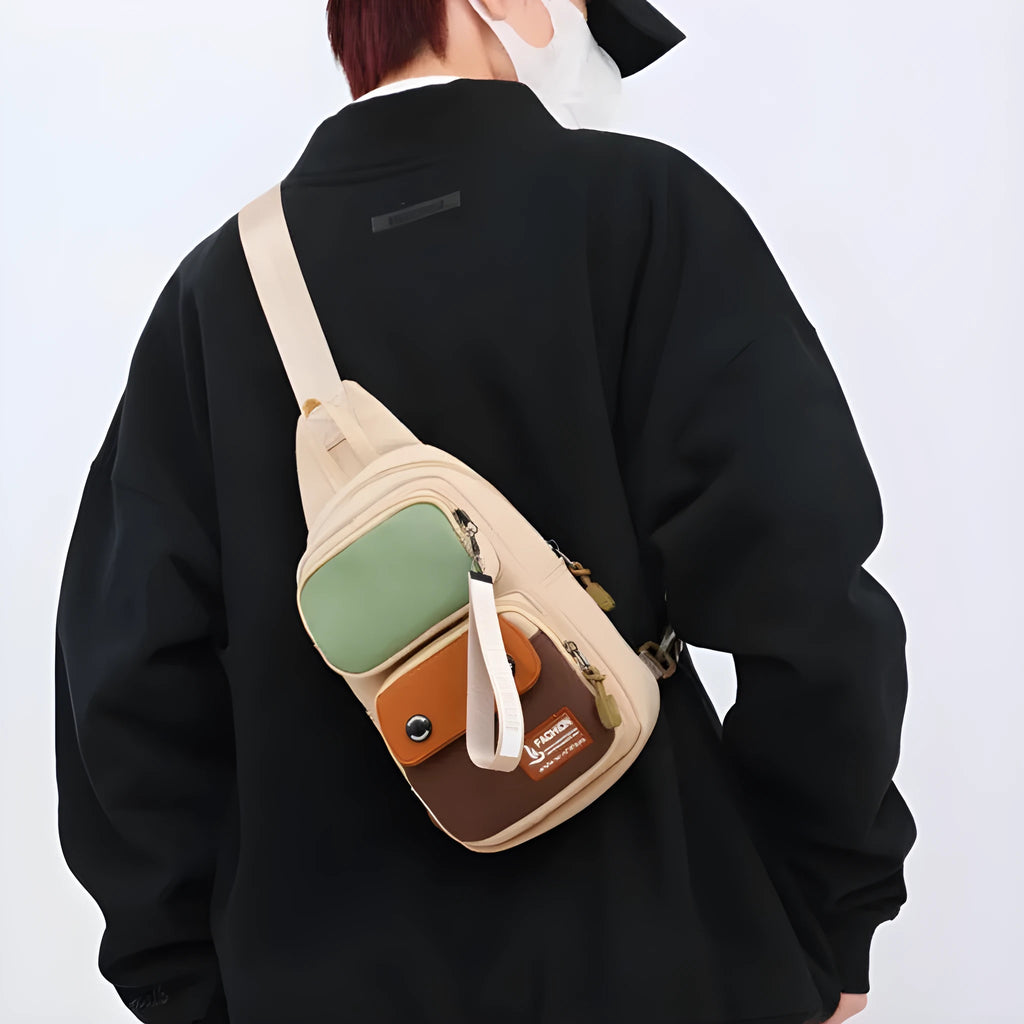 Crossbody shoulder bag in nylon with polyester lining, showing storage compartments