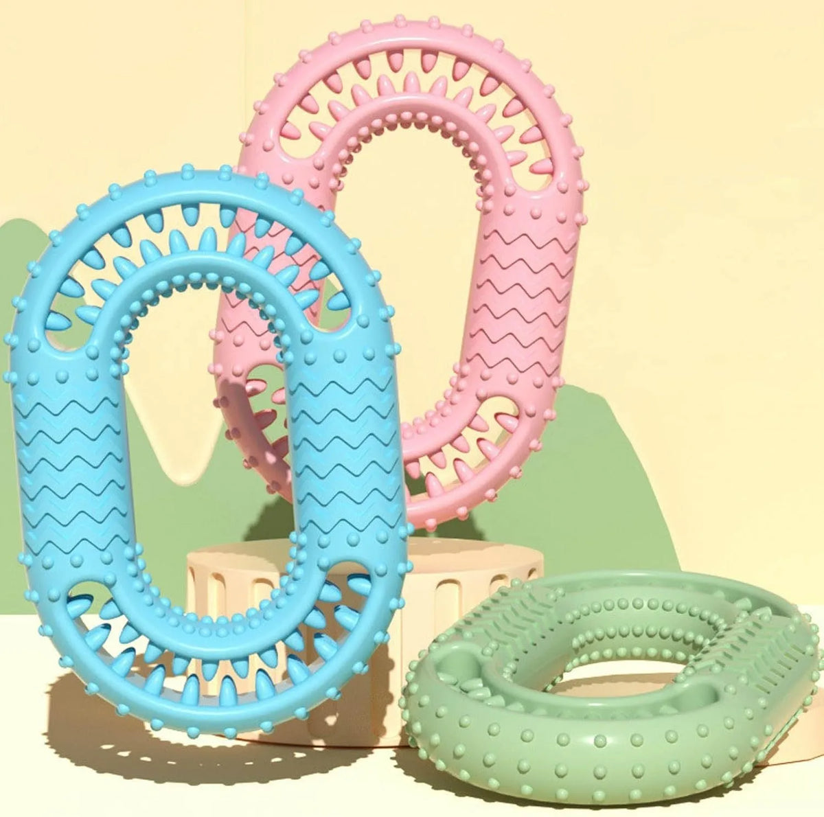 Blue green pink O-ring shaped dog chew toy for aggressive chewers measuring 12.5 by 8.6 centimetres