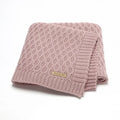 Solid colour infant hug blanket with three-dimensional lines in soft acrylic fabric, shown in light green colour