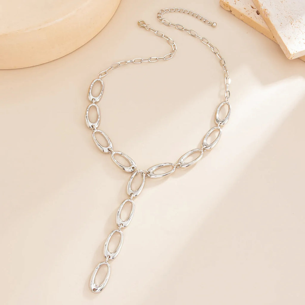 Y-shaped cross chain necklace in alloy with geometric oval pendant, Gold or White K finish, 51-60cm perimeter.