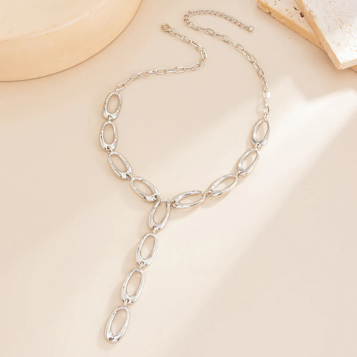 Y-shaped cross chain necklace in alloy with geometric oval pendant, Gold or White K finish, 51-60cm perimeter.