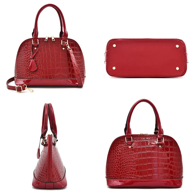 Shiny PU shoulder bag in shell shape showing black, brown, and red colour options
