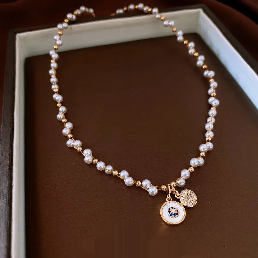 Gold electroplated necklace with round pearl pendant on adjustable 41-50cm clavicle chain