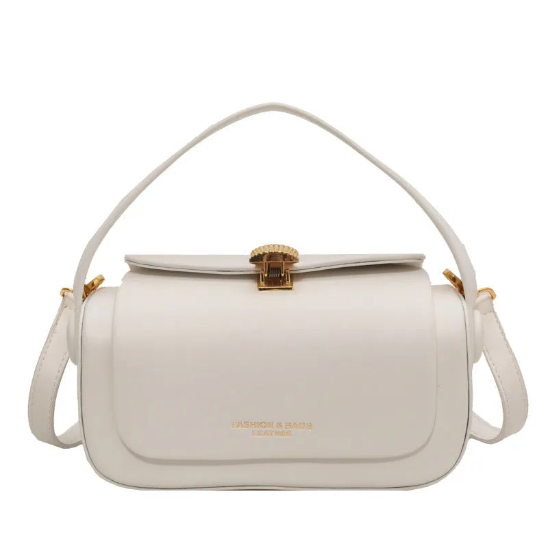 Women's personalised shoulder messenger bag in PU leather with letter detailing and stitching.