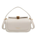 Women's personalised shoulder messenger bag in PU leather with letter detailing and stitching.