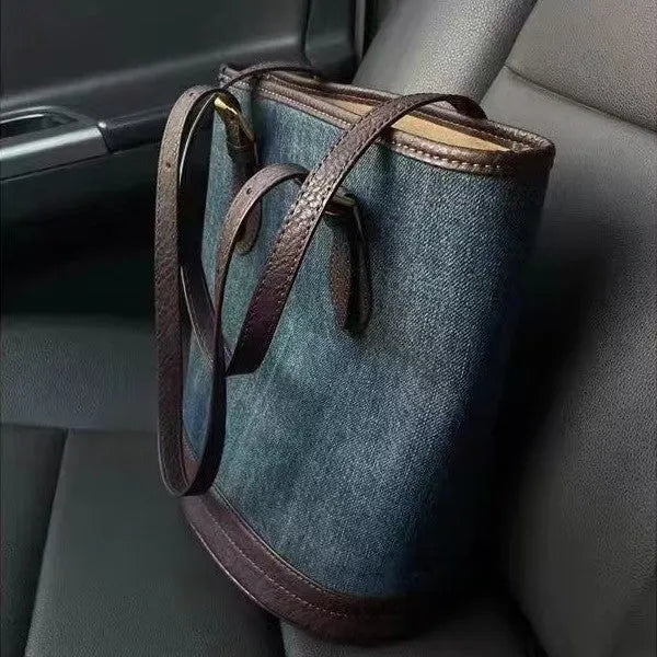 Denim patchwork one-shoulder bucket handbag with large open top, shown in denim commuter colour.