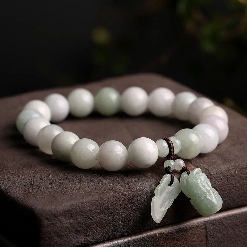 Natural jade bracelet with Maitreya Buddha charm and geometric design