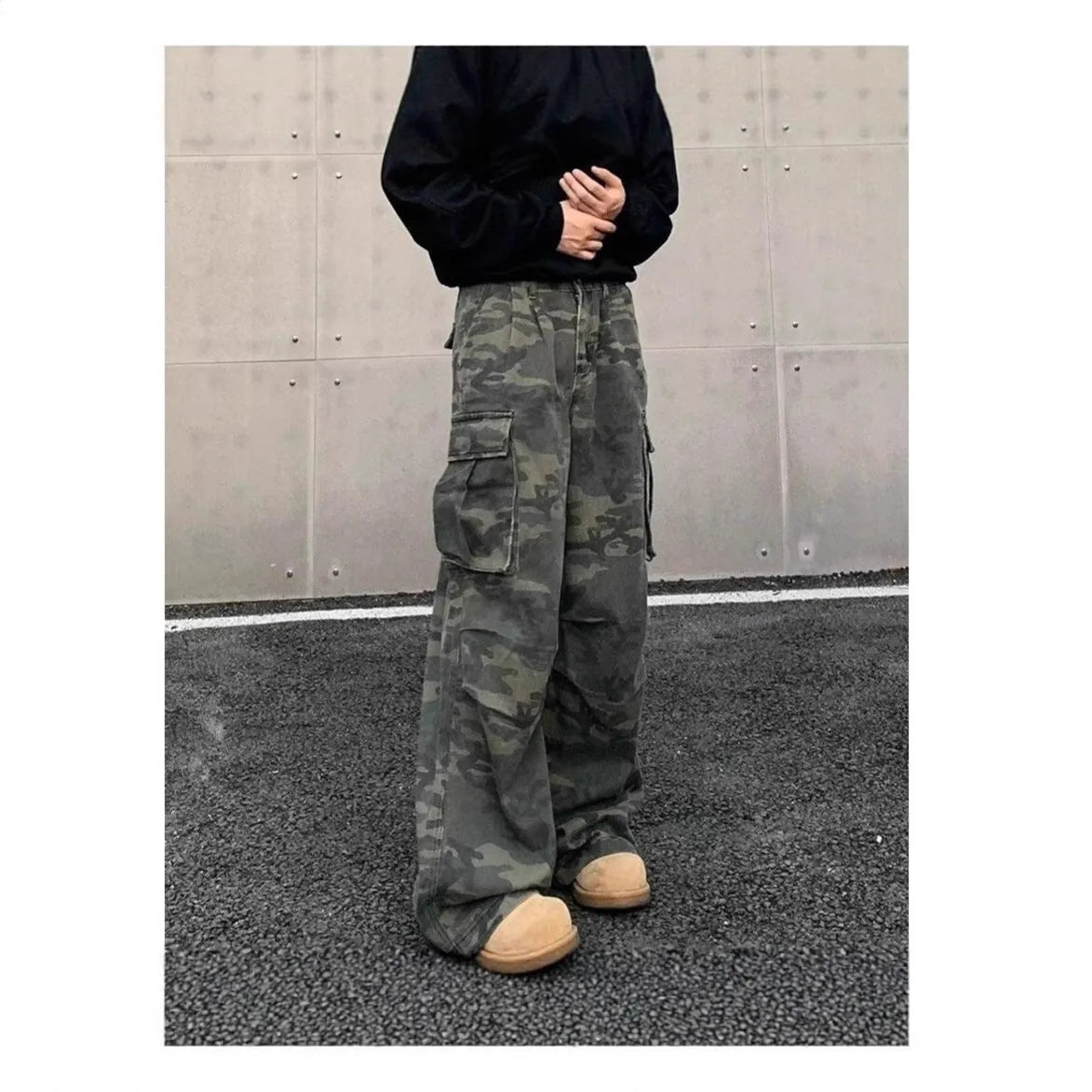 Washed camouflage cotton blend cargo trousers with multiple pockets on a mid-rise waist.