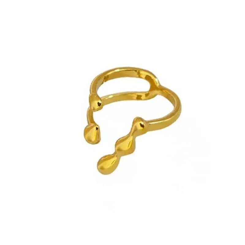 Adjustable brass opening ring with spherical detail in gold or silver colour
