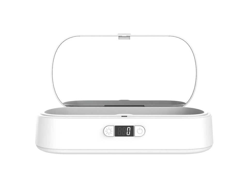 White ultraviolet steriliser box with wireless charging for mobile phones and personal items