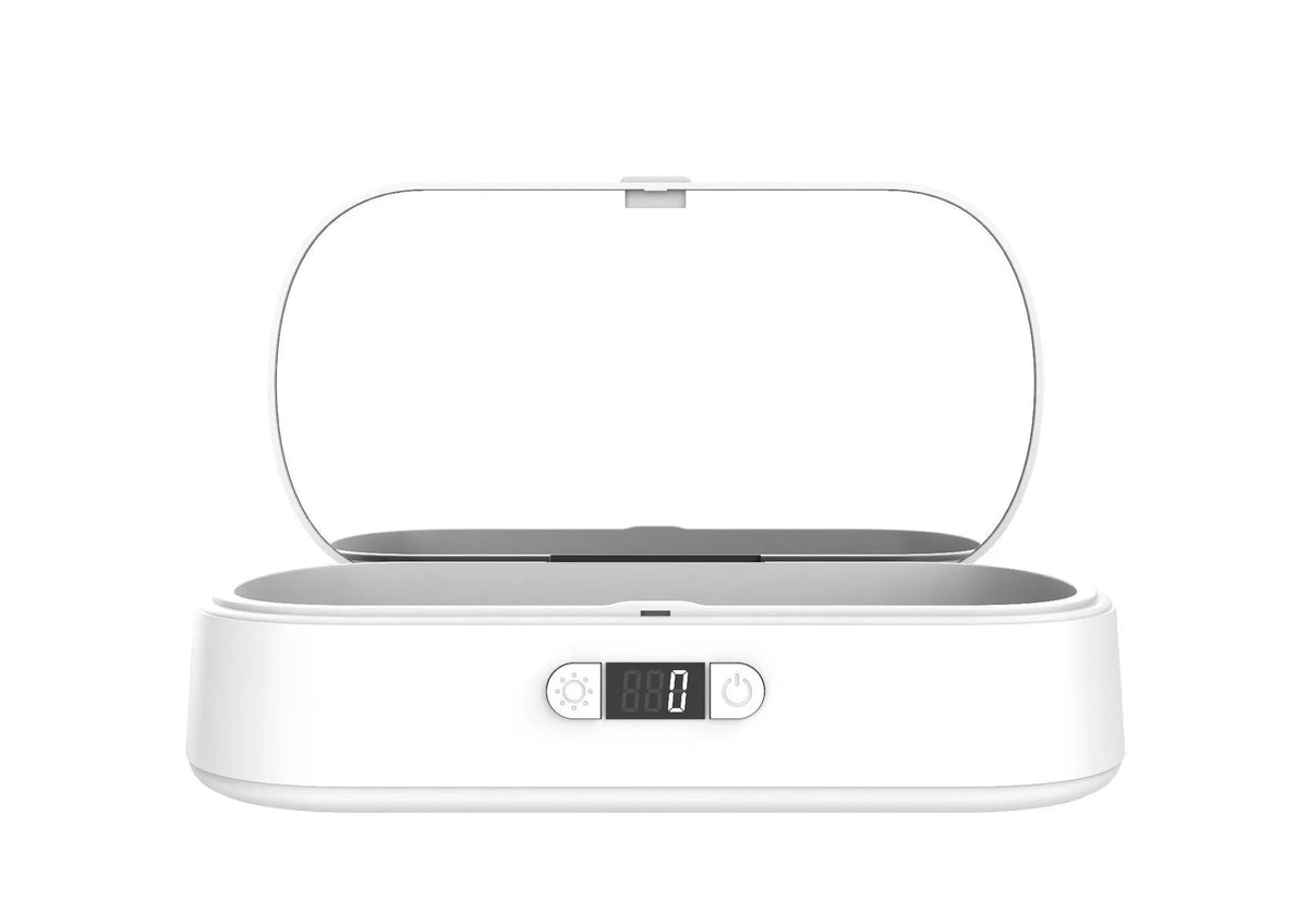 White ultraviolet steriliser box with wireless charging for mobile phones and personal items