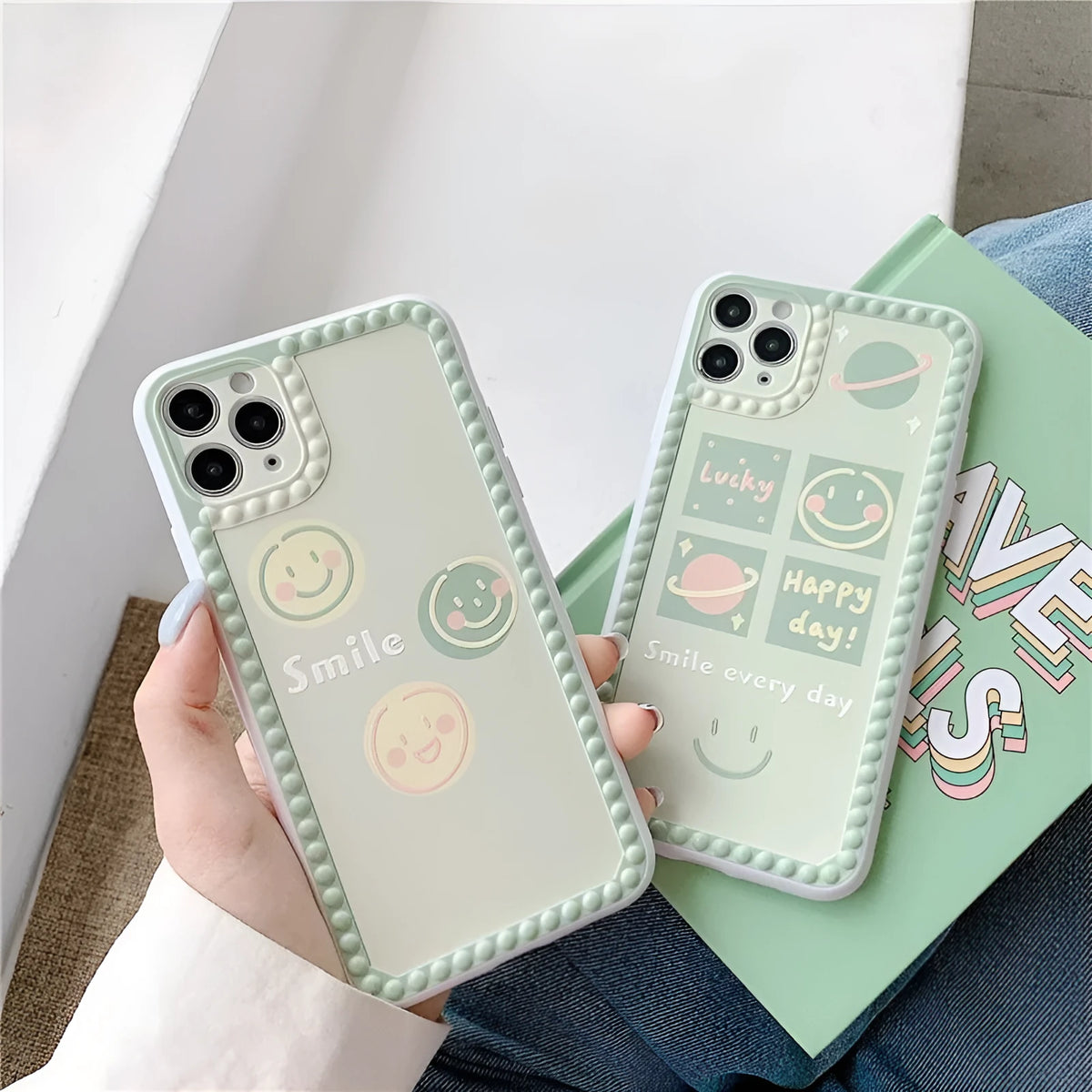 Green TPU iPhone case with geometric smiley face design, shown in polka dot frame and square grid styles.