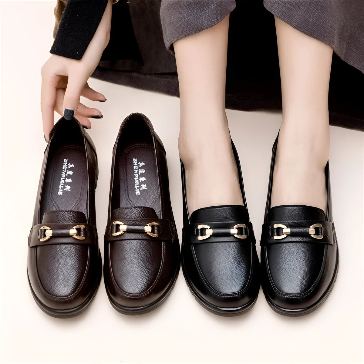Black women's soft leather slip-on pumps with a rounded toe and low flat heel.