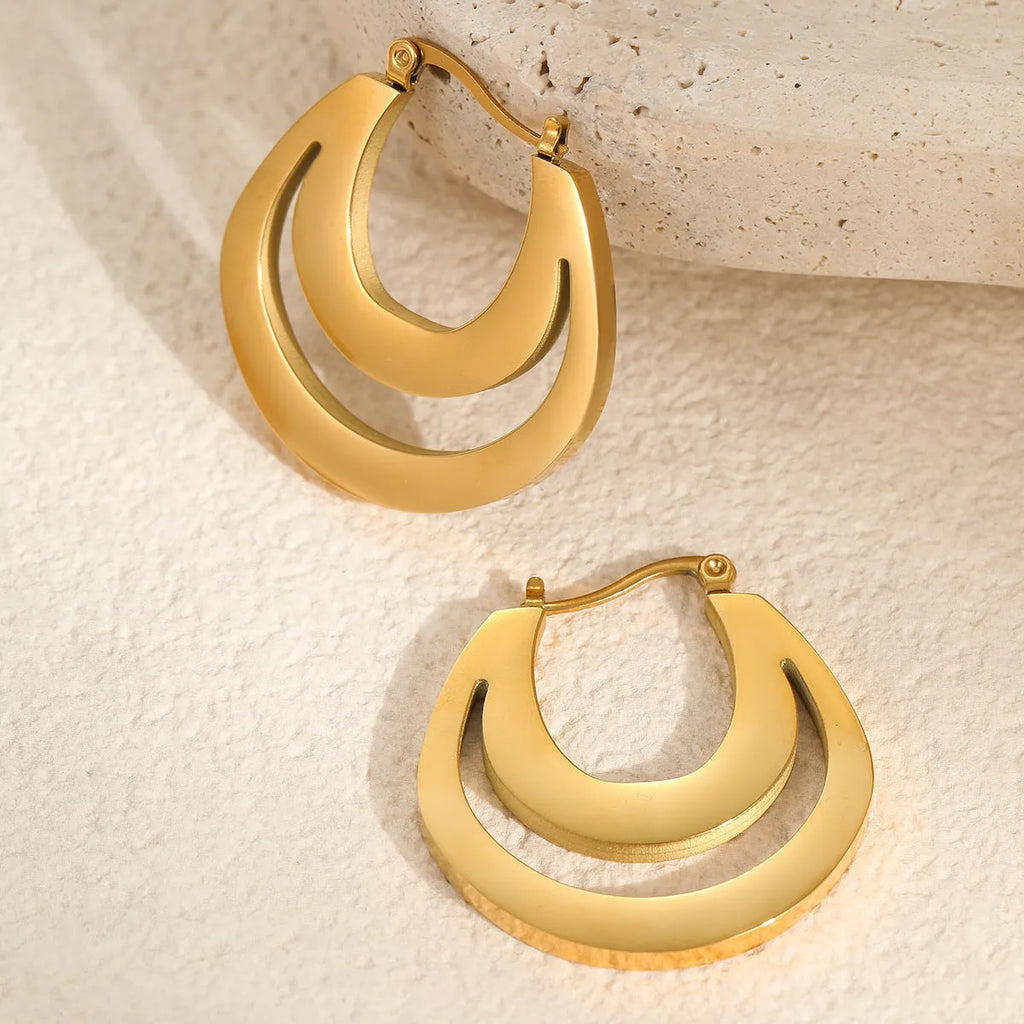 Geometric French earrings with round ring design in 18K gold-plated stainless steel, shown in gold and steel silver finishes.