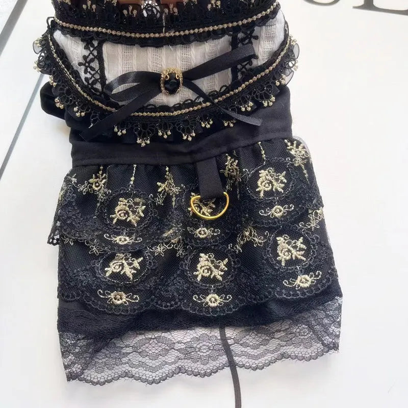 Golden gothic princess-style tiered skirt dress for a small dog or cat on a mannequin.