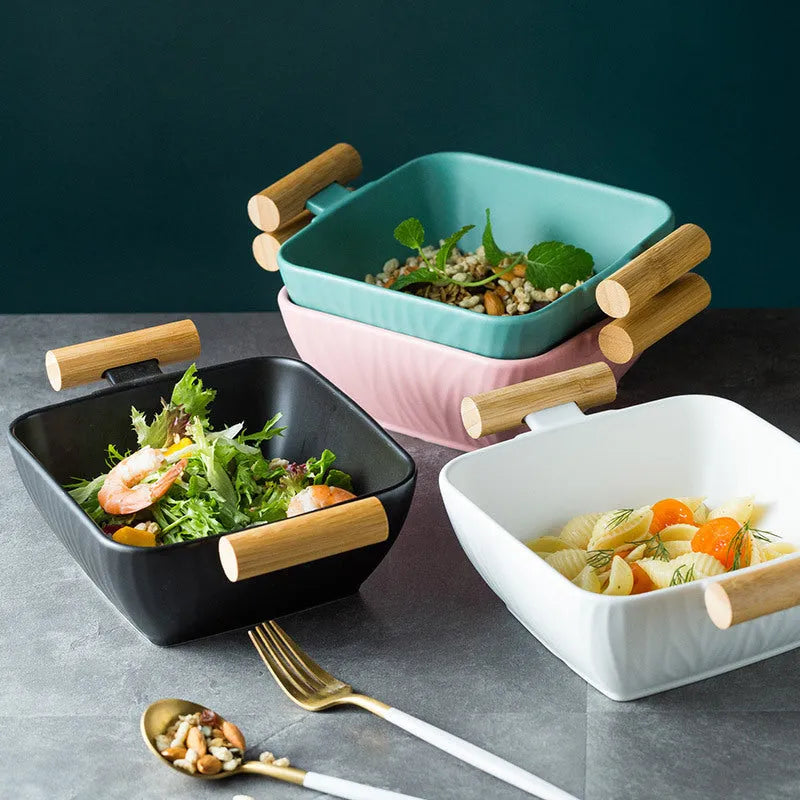 Irregular shaped ceramic bowl with matching lid in porcelain, shown in available colour options