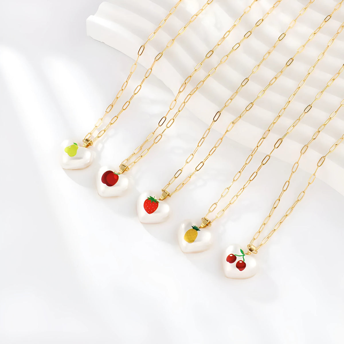 Geometric heart necklace with fruit pendant on adjustable chain in apple cherry pear pineapple strawberry designs