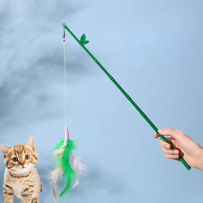 Green interactive cat feather wand toy with bell and feather attachments for indoor play