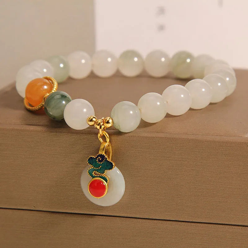 Women's ice jade bracelet with pearl detailing and traditional jade buckle