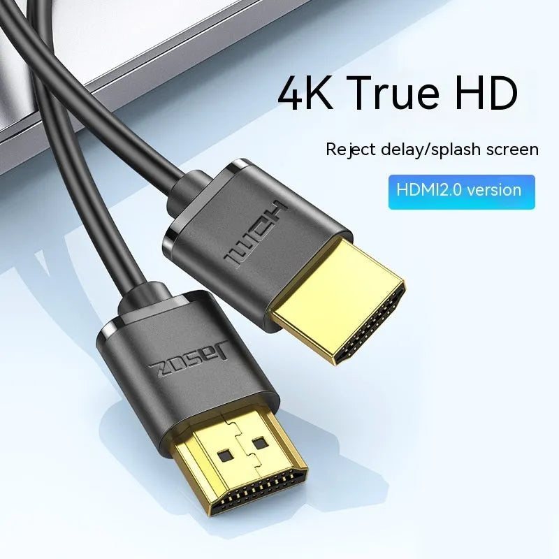 Flexible HDMI video cable with gold-plated connectors, shown in a hairline finish, suitable for computers and projectors.