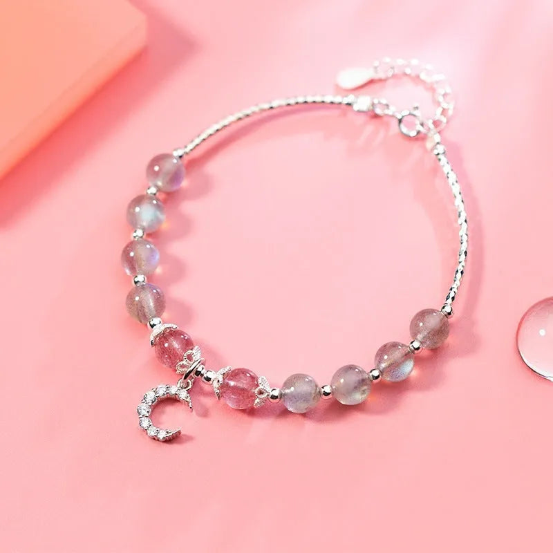 Handmade adjustable silver tone bracelet with natural moonstone crystal and small crescent moon charm