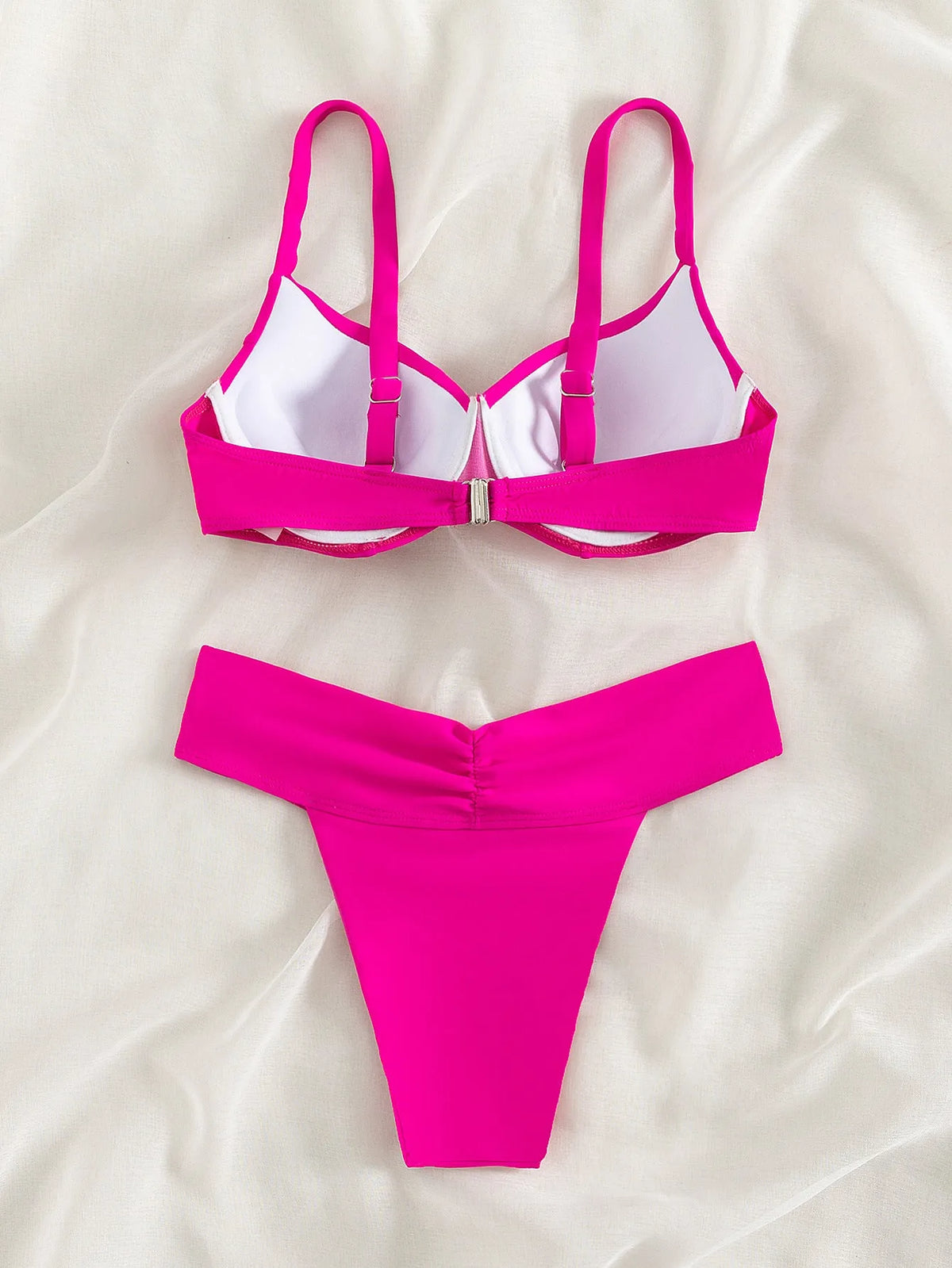 Solid colour women's bikini swimsuit on a hanger, showing briefs style and sleeveless design.