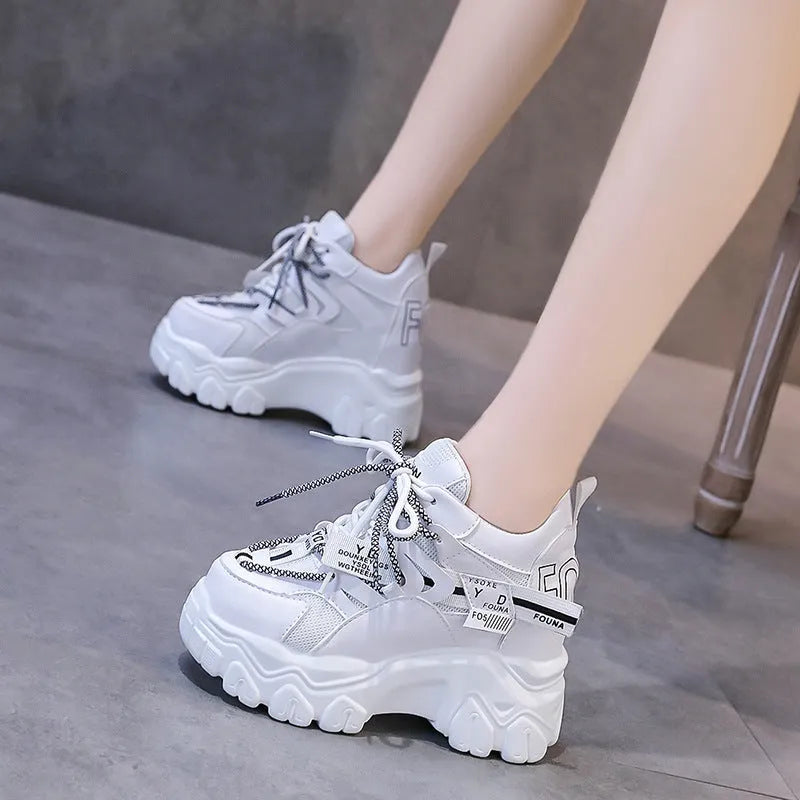 Women's white mesh platform sports shoes with a cross-strap design and rubber sole