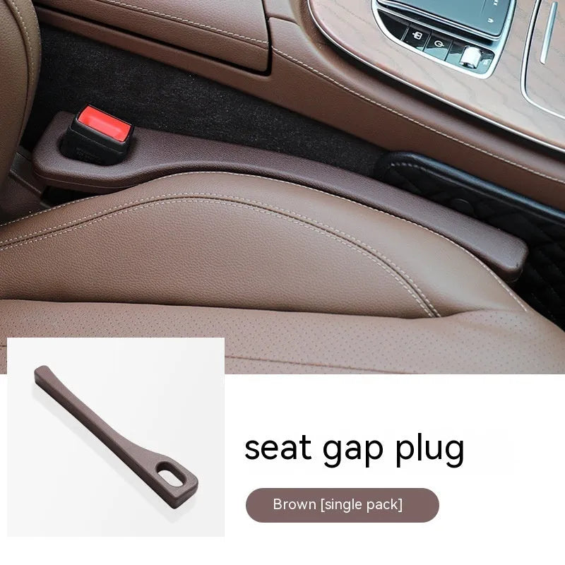 Polyurethane car seat gap filler strip in beige colour against a car interior
