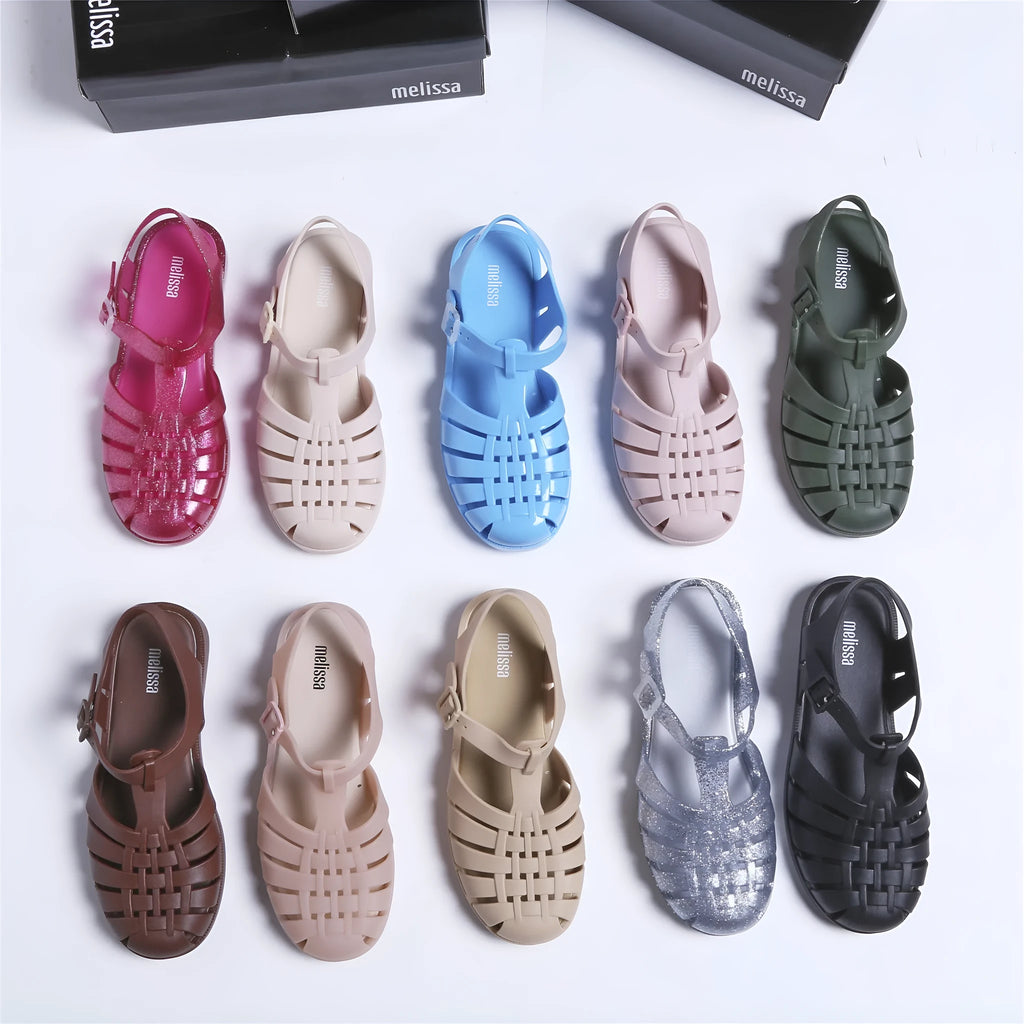 Roman sandals with buckle closure in PVC material showing vintage weave design and hollow-out elements