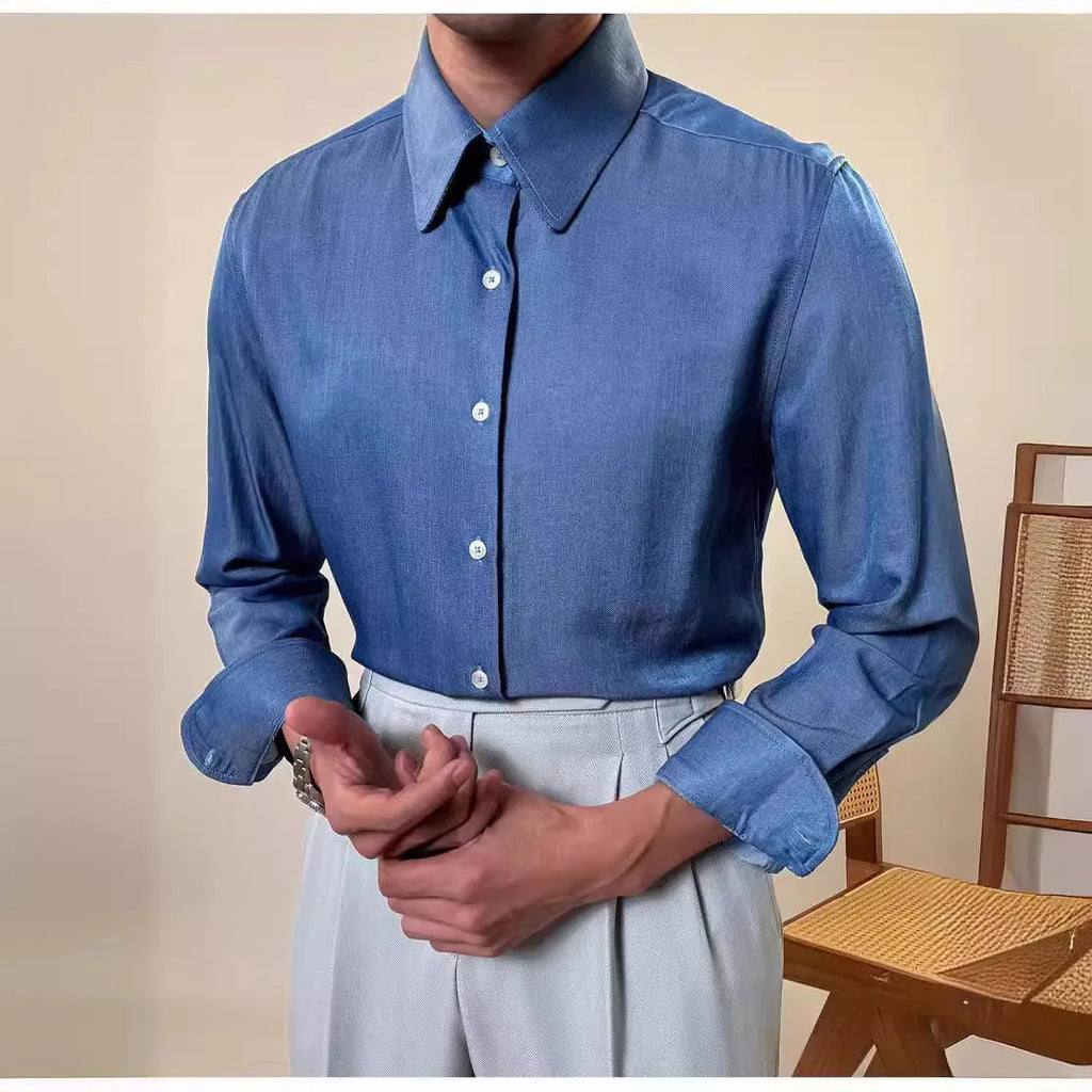 Man wearing a slim fit light blue long sleeve shirt with a round collar