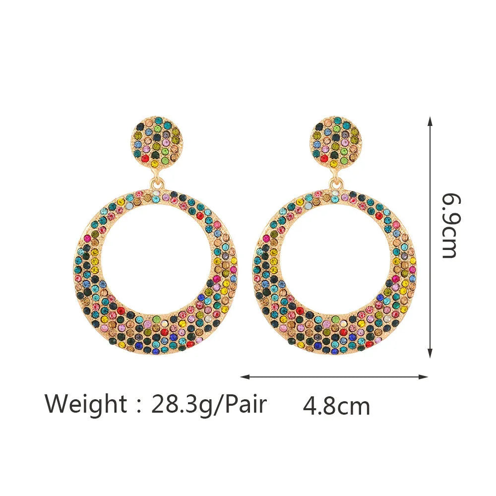 Coloured alloy metal earrings with large round diamond pendant in cartoon style design