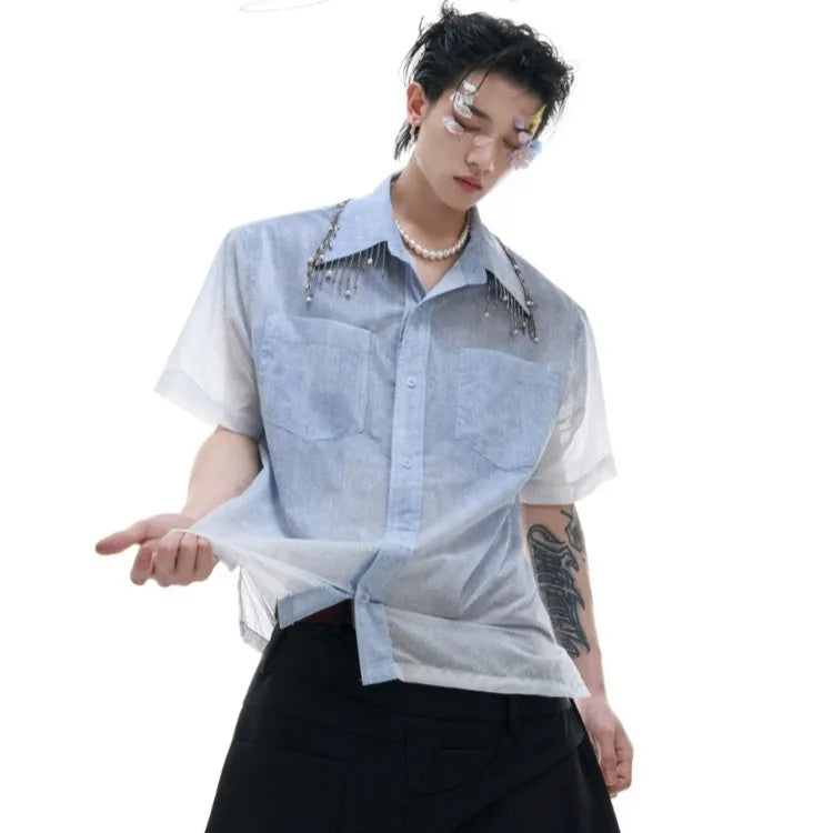 A loose-fitting men's blue to white gradient short-sleeve shirt for casual summer wear.