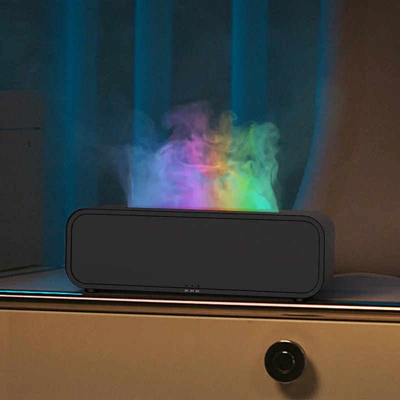 Black cylindrical aroma diffuser with colour-changing LED lights and remote control
