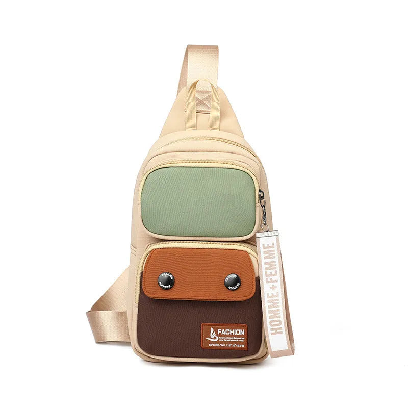 Crossbody shoulder bag in nylon with polyester lining, showing storage compartments