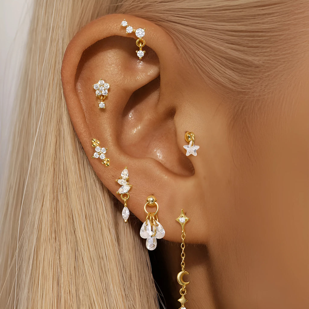 S925 sterling silver geometric moon earring with an embedded star detail in a gold colour finish.