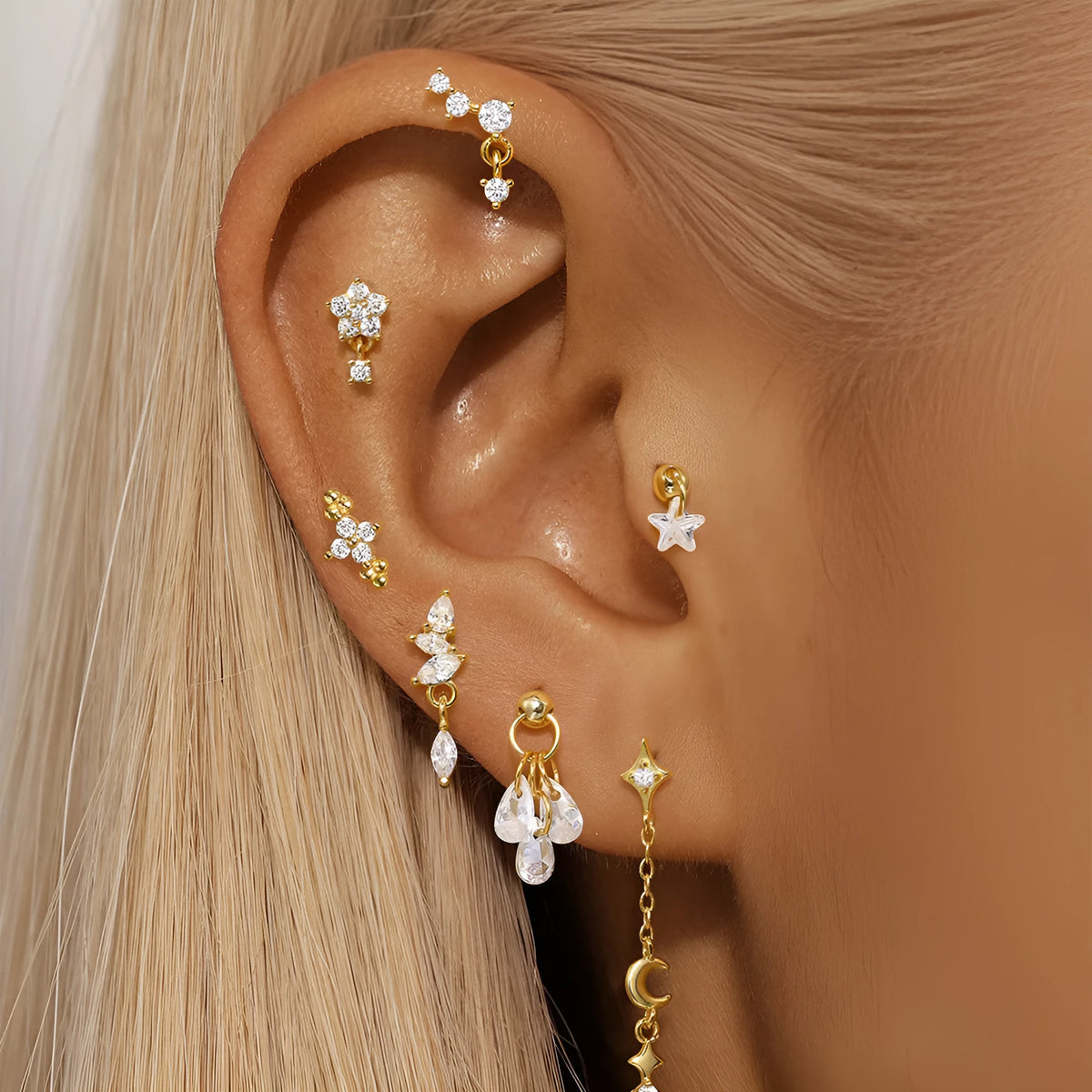 S925 sterling silver geometric moon earring with an embedded star detail in a gold colour finish.