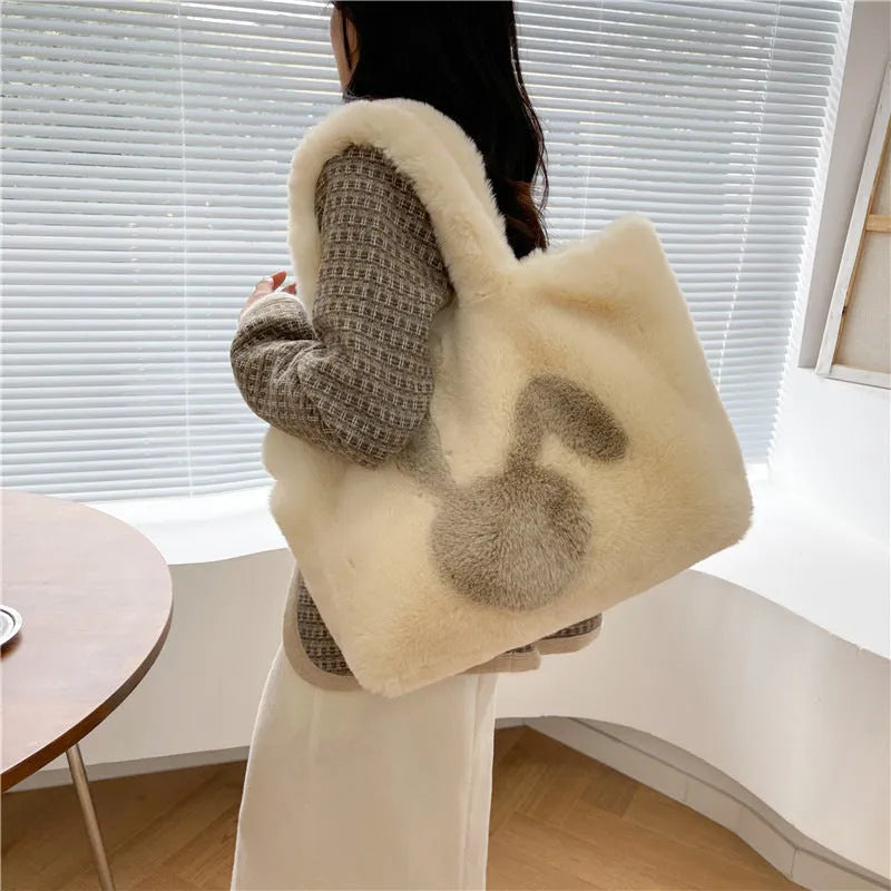 Plush shoulder bag with cartoon rabbit ears in solid colour with shoulder strap