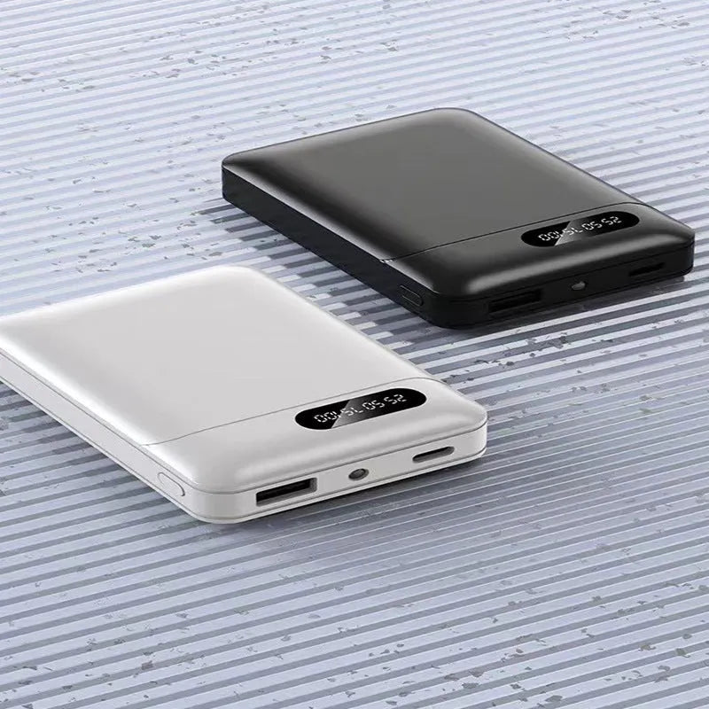 Black and white portable power bank with 10000mAh capacity and USB charging ports