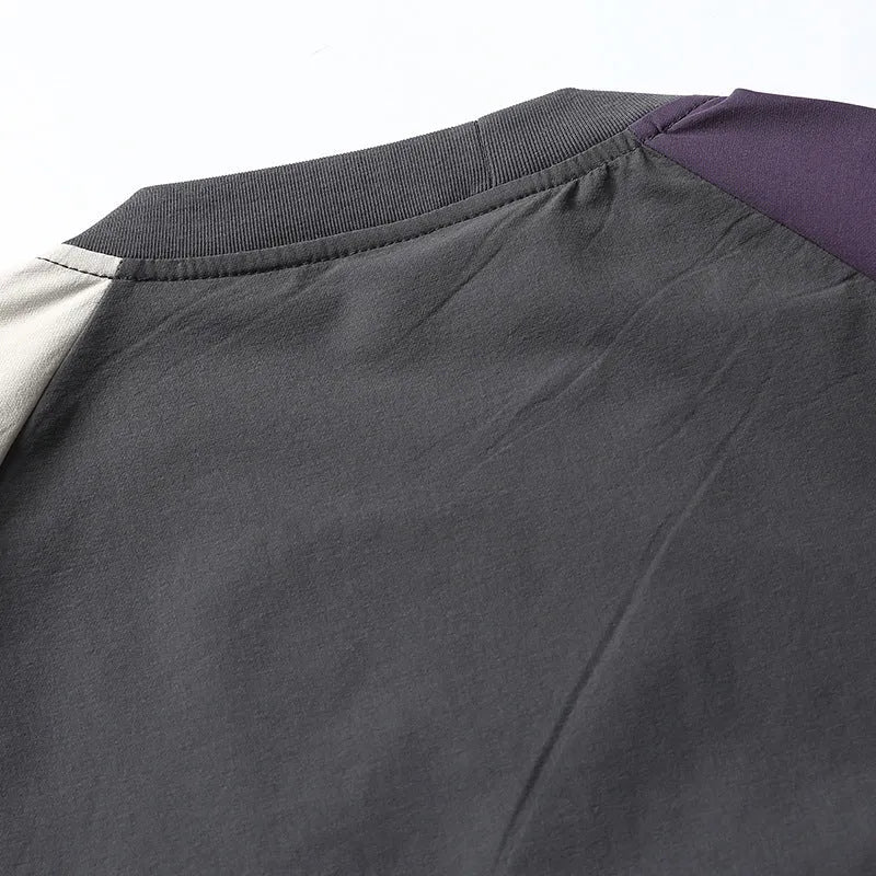 Dark grey loose-fit T-shirt with contrast colour raglan sleeves showing quick-drying polyester construction