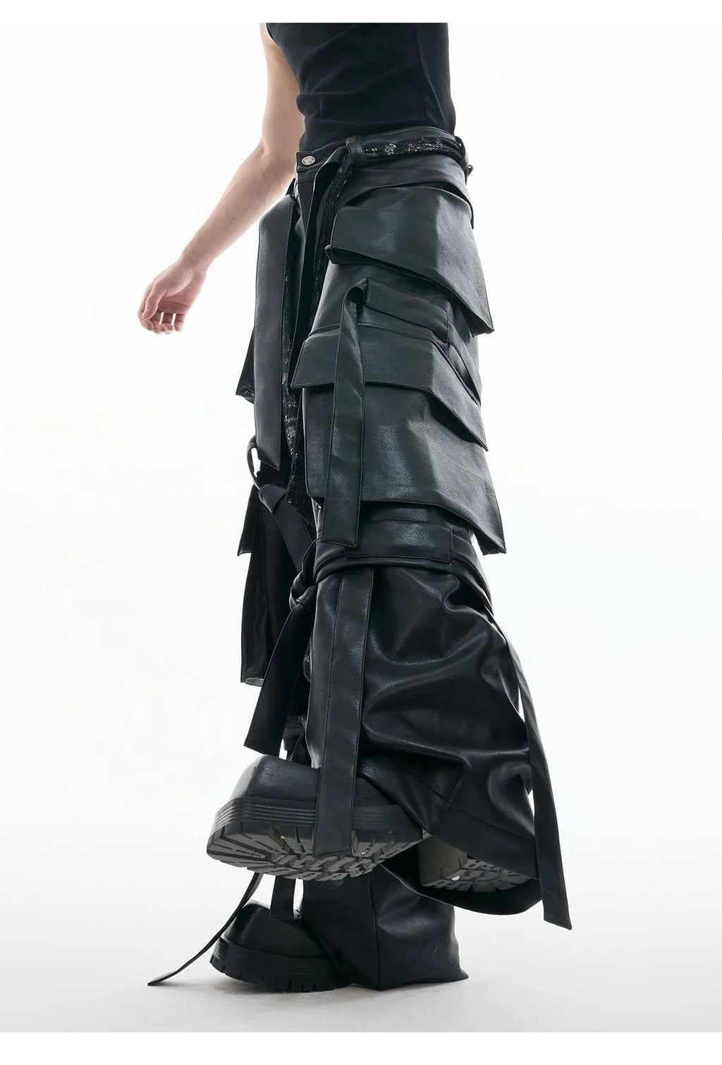 Black loose-fit men's trousers with quilted panels and multiple pockets.