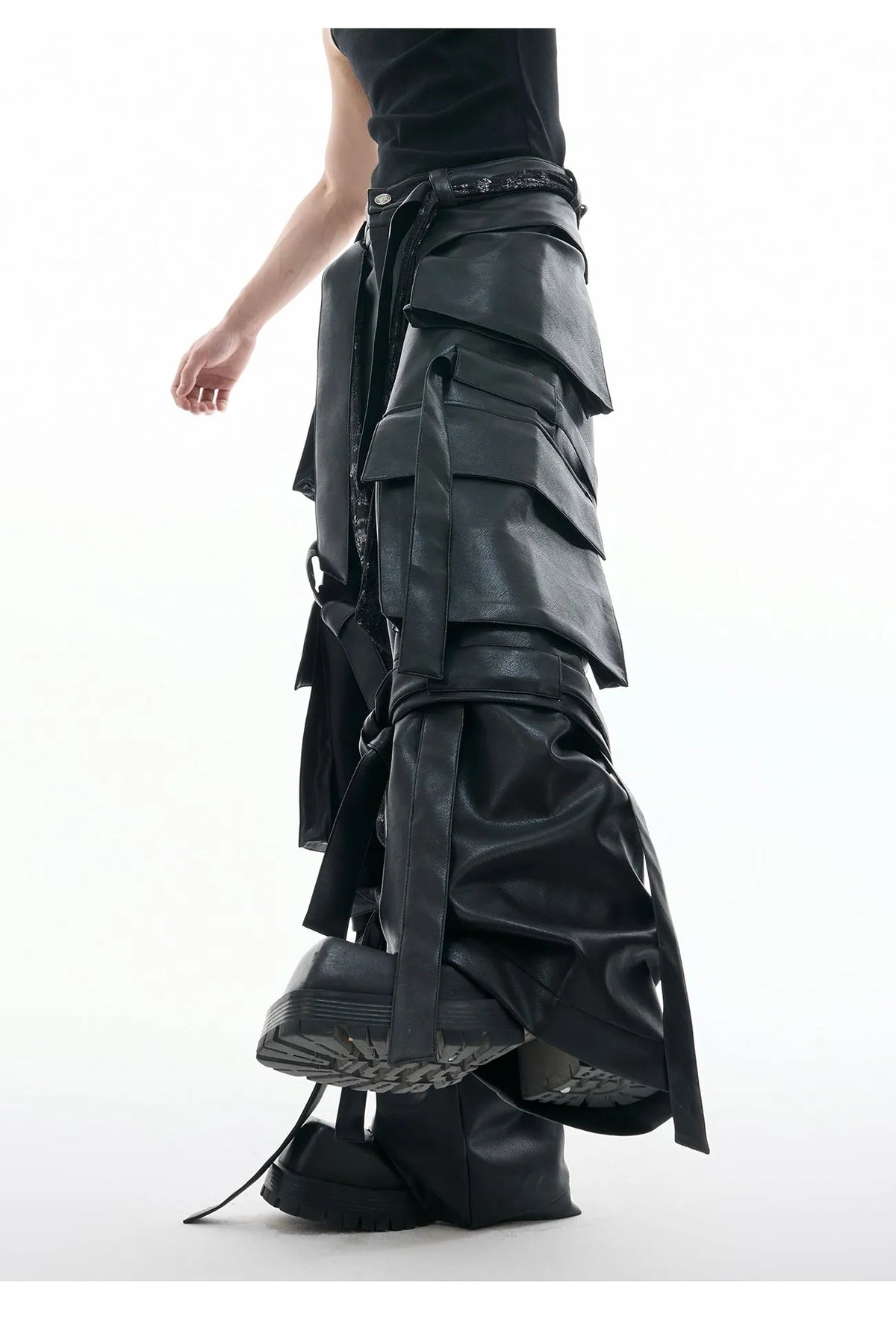 Black loose-fit men's trousers with quilted panels and multiple pockets.