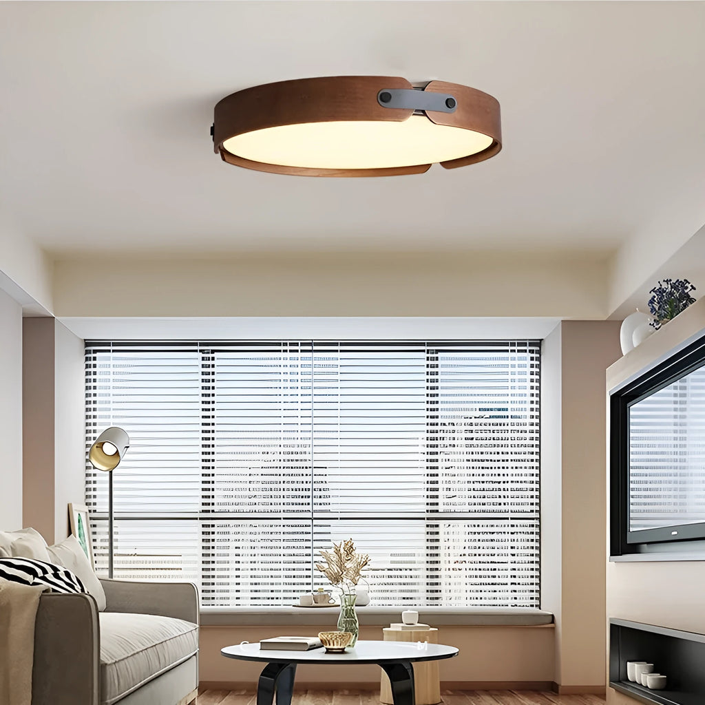 Japanese style wooden ceiling lamp with a PMMA shade in a warm light colour, shown in a bedroom setting.