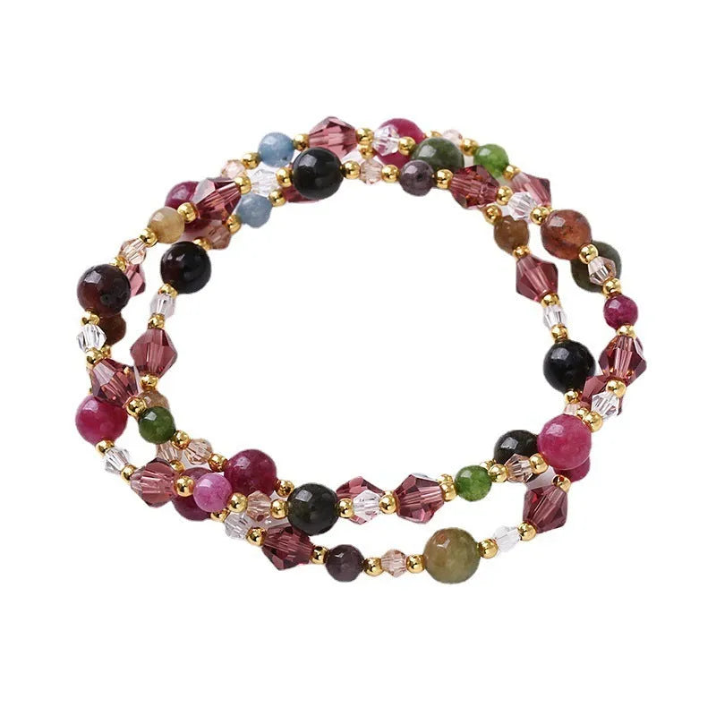 Women's adjustable crystal bracelet with three gemstone rings on rope band