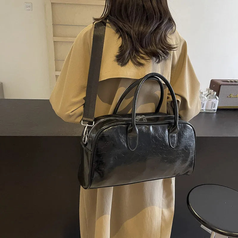 Women's lightweight PU leather travel bag with 20-35L capacity, dry wet separation, and wine red, black, or beige colour options
