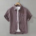 Loose fit short sleeve lyocell cardigan top in black, green, or purple.