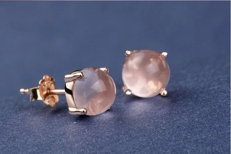 Rose gold drop shape stud earrings with crystal inlay detail on synthetic ross quartz
