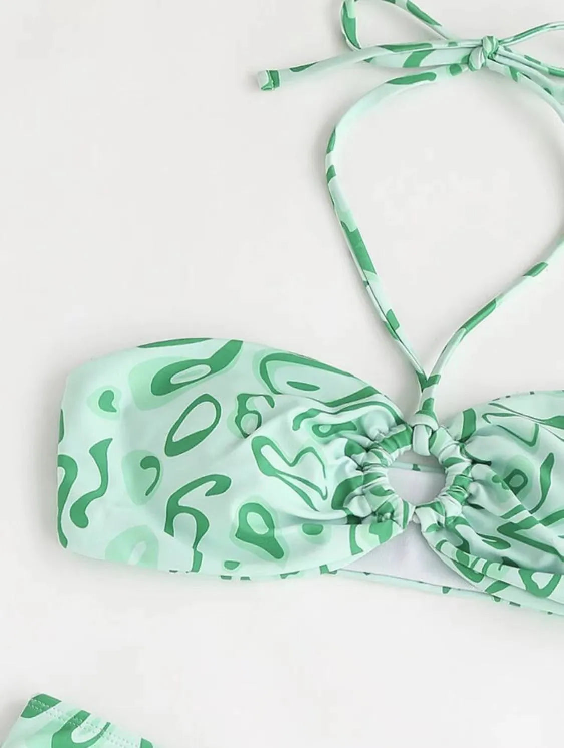 Women's green floral bandeau split swimsuit with triangle top and matching briefs