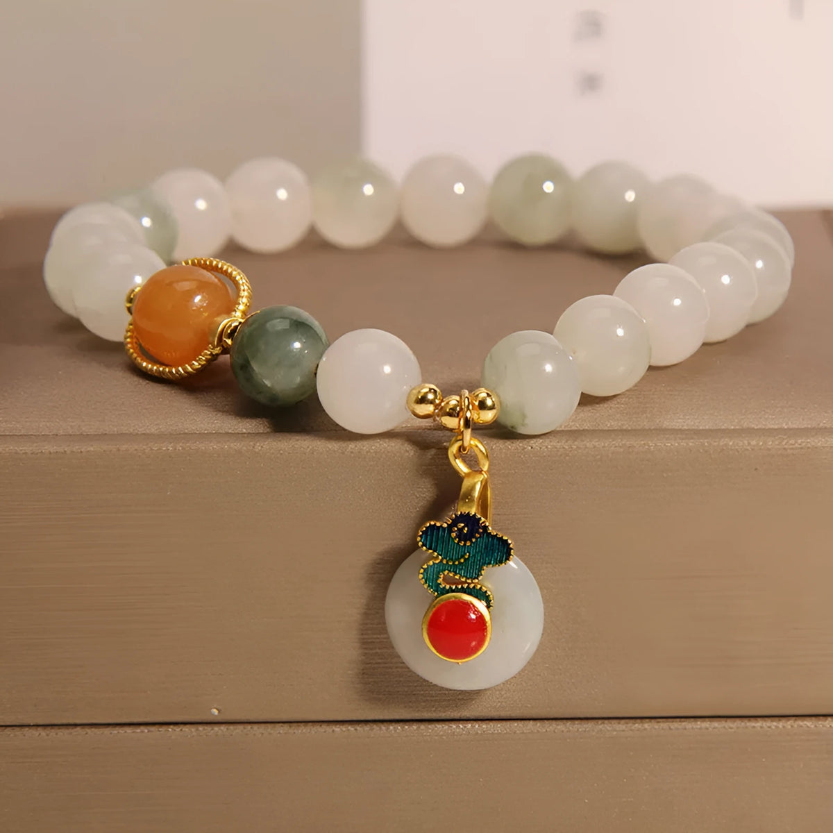 Women's ice jade bracelet with pearl detailing and traditional jade buckle