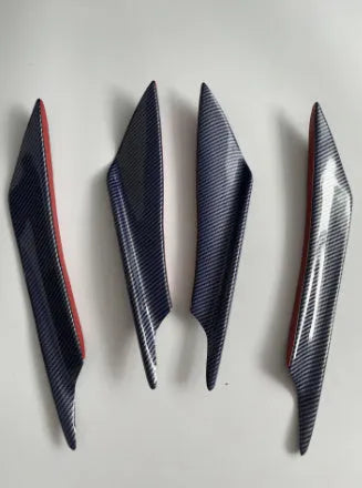 Set of four black carbon fibre pattern ABS plastic air knives for car bumper spoiler installation.