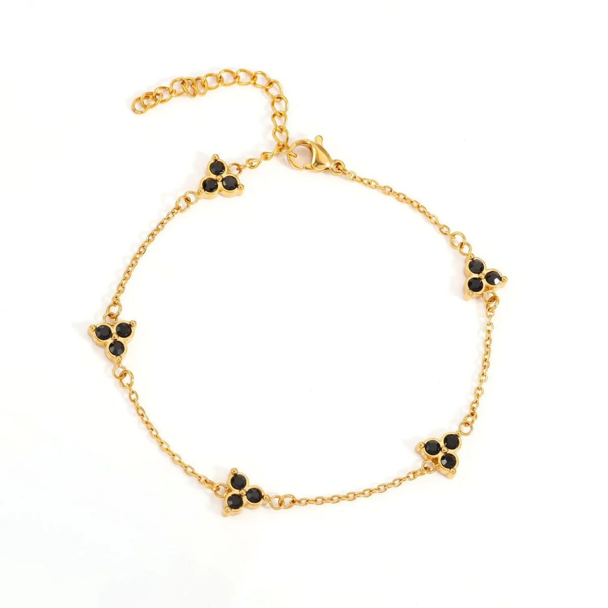 Women's stainless steel geometric bracelet with three diamonds and a coloured zircon stone in a triangular setting.